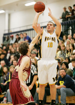 Co-captain Chris Faidley, â€˜09, shoots over opposing player in Whitmans win over rival Willamette, 88-84 in overtime.