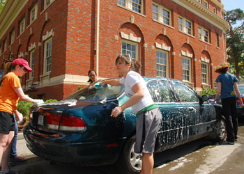 Kappa Alpha Theta members Annie Horman, â€˜11, right, and Emily Ufheil-Somers, â€˜09, left, soap up a car at the April 25 car wash fund-raiser.  Proceeds were donated to the Helpline womens shelter. Credit: Falltrick