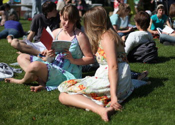 Hannah Sieracki, â€˜12, and Shannon Morissey, 12, leaf through the pages of the new blue moon. Credit: Norman