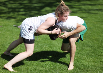 Rebecca MacFife, â€˜11, tussles with a fellow wrestling club member at a club gathering. Credit: Norman.