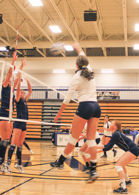 Outside hitter Alex Graves 10 goes for the kill against Lewis-Clark State. Courtesy of Carver Marshall