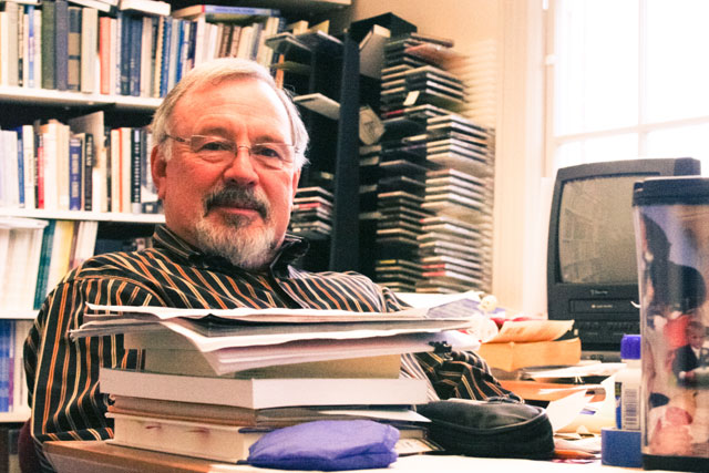 Professor Robert Withycombe sits in his office stacked with books and files from 29 years of teaching at Whitman. The Carnegie Foundation acknowledged Withycombes efforst with its 2009 Washington State Professor of the Year award. Credit: Hong