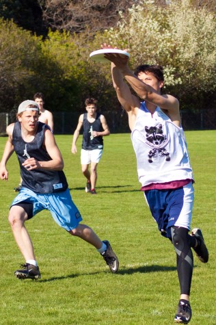 Jeremy Norden 11, marked by Peter Burrows 13, clamshells the frisbee during practice. Photo Credit: Ethan Parrish