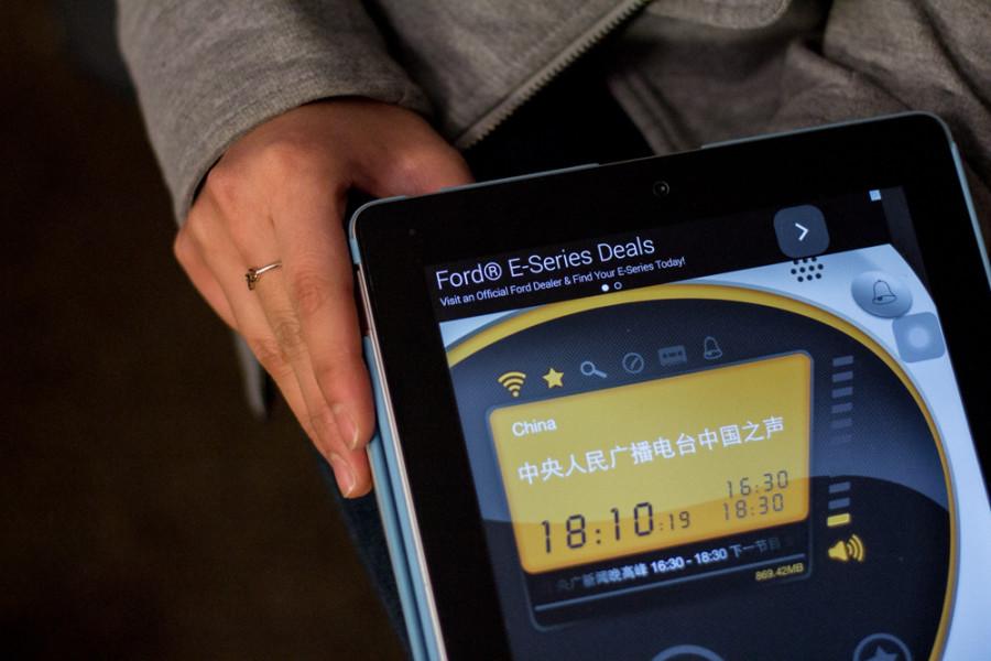 Suzy Xi 15 uses an iPad radio app to keep up on news from China.