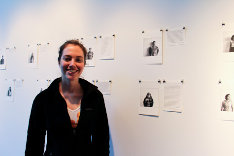 Maia Watkins 17 displays her photographs in Fouts Center for the Visual Arts. Photo by Emily Volpert.