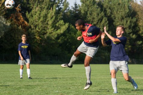 Senior Trayvon Foy heads the ball during a defensive drill. 