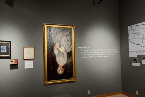 A Proper Monument a joint faculty and student curated exhibit in Maxey Museum, adds to the discourse surrounding the defacement of the Whitmans monuments. It featured the restored Narcissa Whitman portrait, here hung upside down with an accompanying definition of vandalism.