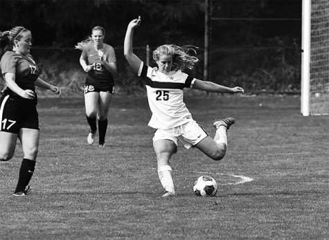 Renee van Bergeijk 19 looks to hit a long ball to create an opportunity for her outside midfielders. Photo courtesy of Whitman College. 