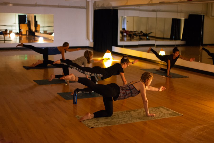 Yoga club leader Devi Payne leads a yoga class
