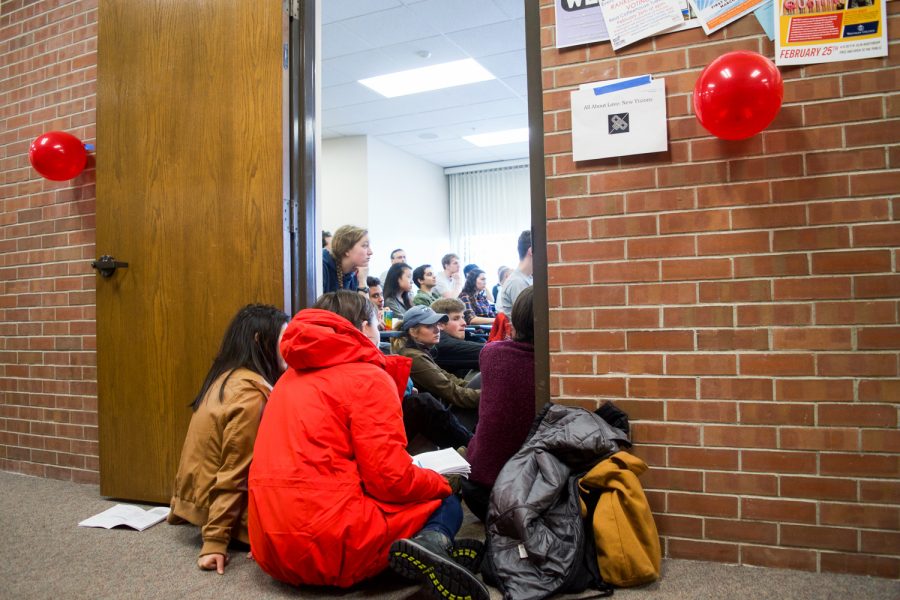 Students sit outside of a session during block one of the Power and Privilege Symposium. This years Symposium san an increase in attendance in compared to the year before. 