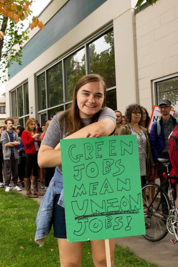 Avery Le- Clair 21 pauses for a photo while marching in the climate strike