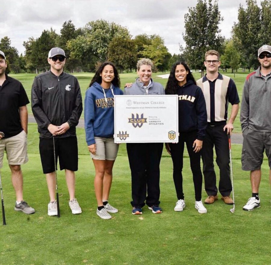 First-year basketball players Caira Young and Shaira Young pose with Kim Chandler and participants of the W Club golf tournament. Photo contributed by Shira Young