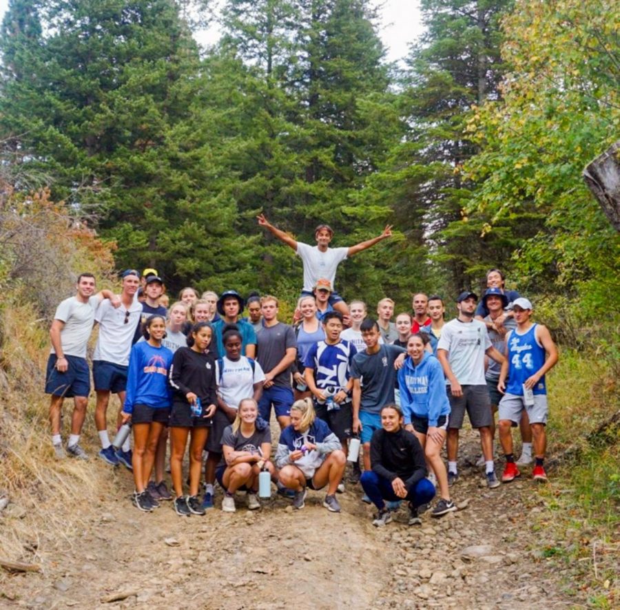 Whitman womens basketball and mens tennis pose at the top of their hike after completing the Blue Mountain Challenge on Friday, Sept 13. Photo contributed by Emily Solomon 