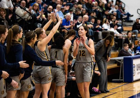 Senior Lily Gustafson high-fives teammates. Photos by James Baker