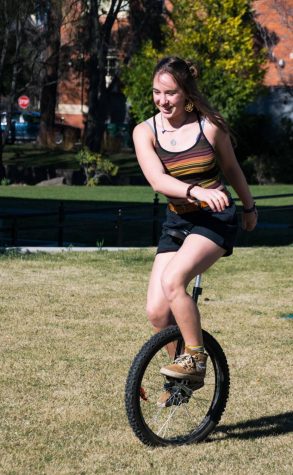 Kaia Schweig getting around on her unicycle. Photos by Michael Lans