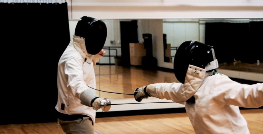 Two students in fencing club duel in Italian style, the more artistic of the two fencing styles. Photo contributed by West Skrobiak-Bales