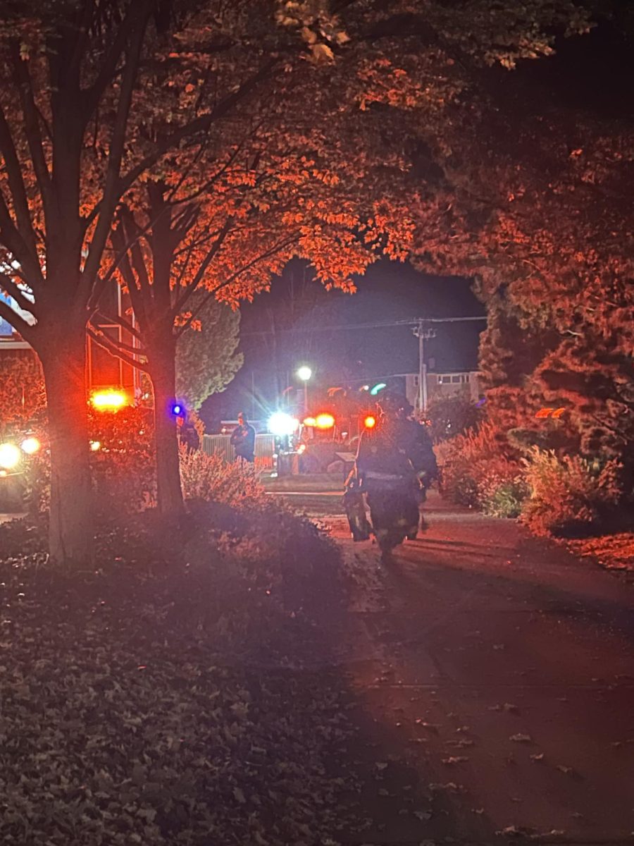 Firemen leave the library.